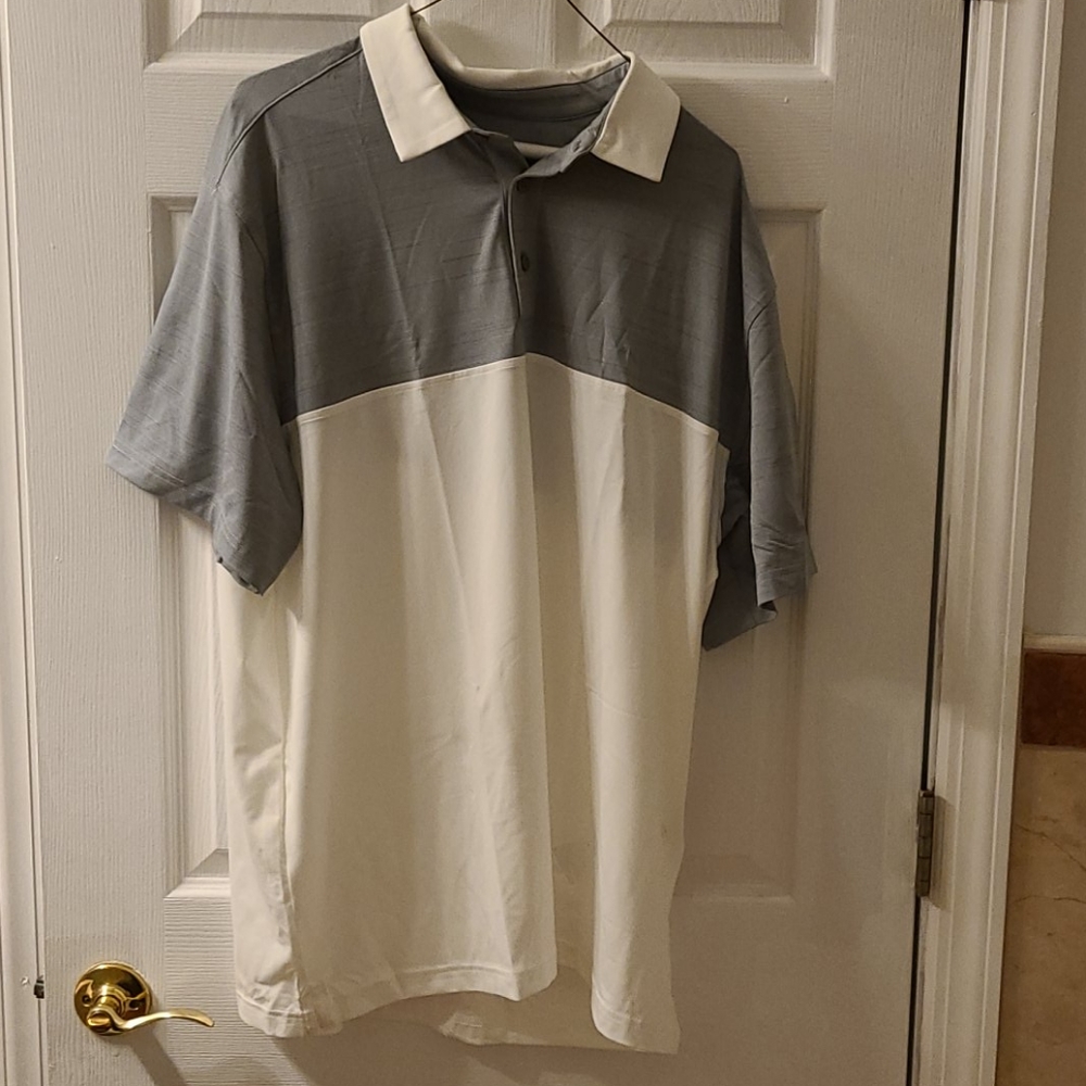 A brand new 2xl under armour polo shirt